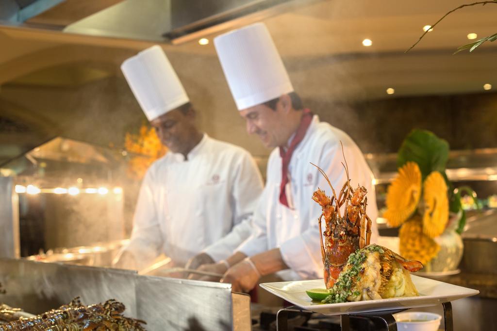 Majestic Elegance Punta Cana (Adults Only) Εξωτερικό φωτογραφία Two chefs working in a hotel kitchen
